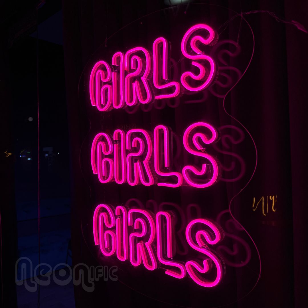 pink neon sign that says girls girls girls